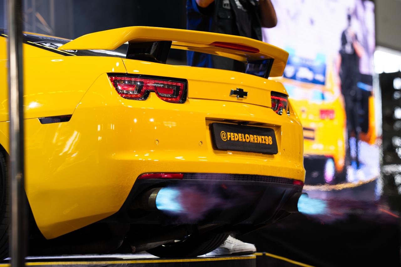 Yellow Chevrolet Camaro rear detail at AMTS indoor car show